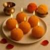 Set of yellow Indian ladoo shaped handcrafted festive candles