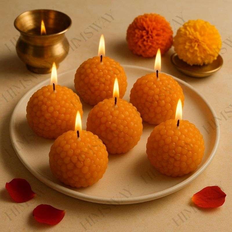 Set of yellow Indian ladoo shaped handcrafted festive candles